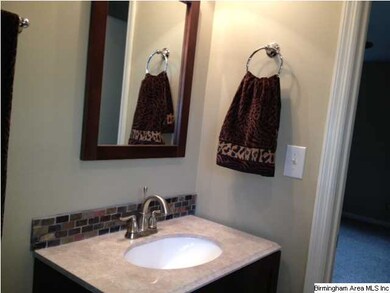 Master bath has new vanity, ceramic tile floor, an