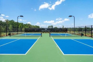 View of sport court featuring community basketball court and fence