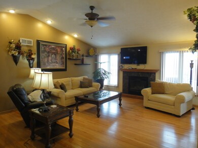 Living Room Features Gas Fireplace and Newer Gleam
