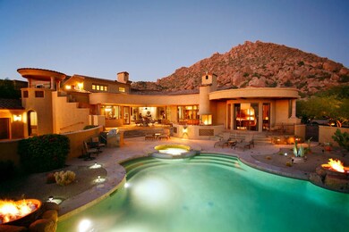 Rear Elev across Pool at Dusk