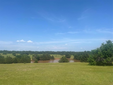 View of green lawn featuring a water view