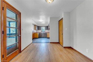 Spare room featuring sink and light wood-type flooring
