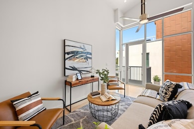 The living space opens up to your private balcony offering stunning Town Lake views. It's the ultimate spot to relax and enjoy the scenery!