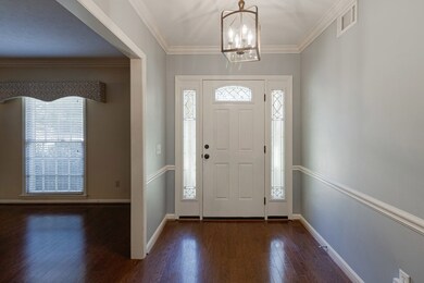 Foyer with new front door and sidelights