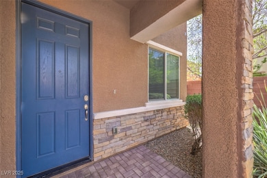 View of exterior entry featuring stucco siding and