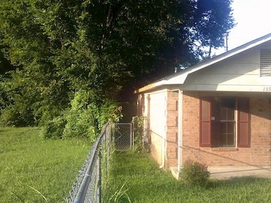 View of side of property with brick siding