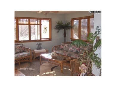 Awesome family room with panoramic view of lovely back yard.