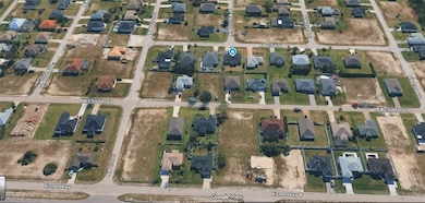 View of property location with nearby suburban area