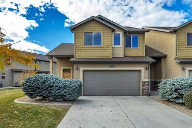 Craftsman inspired home featuring a shingled roof, board and batten siding, concrete driveway, and an attached garage
