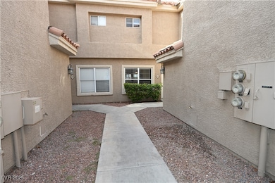 View of exterior entry with stucco siding