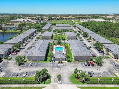 Drone / aerial view of a pool and a nearby body of