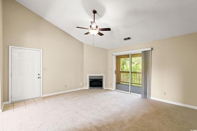 Unfurnished living room featuring light colored ca