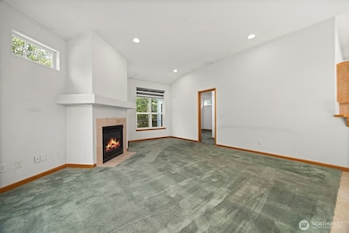 Another view of the large living room with the primary suite beyond.