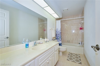 Bathroom with vanity, toilet, tile patterned floor