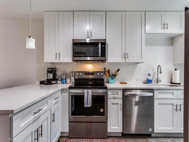 Kitchen featuring stainless steel appliances, pen