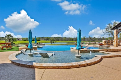 A luxurious infinity pool with a sun shelf, lounge