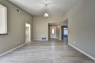 Tiled entry way with direct garage access opening 