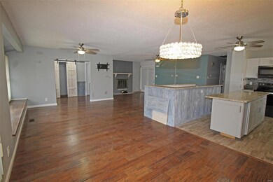 Opens to dining room, great room and kitchen