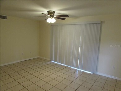 Living room is all tile with new paint, new blinds