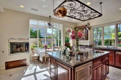 Gourmet kitchen with fireplace and seating