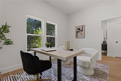 Office space featuring light wood finished floors and baseboards