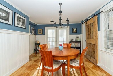 Dining room with door to back deck,...