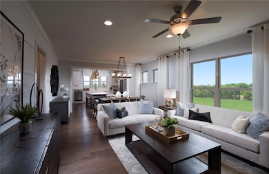 Living area with crown molding, a chandelier, recessed lighting, dark wood-style flooring, and ceiling fan