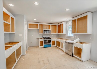 Open spacious eat in Kitchen with painted cabinets