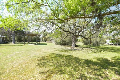 View of yard with a carport