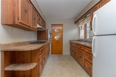 Galley kitchen with eat-in area and a cool swingin
