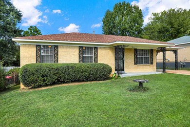 Single story home with a front lawn