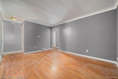 Unfurnished room with light wood finished floors and baseboards