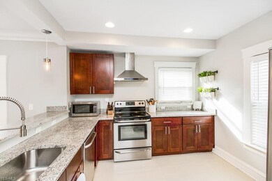 View of the kitchen showcasing updated appliances and the extra large stainless steel sink.