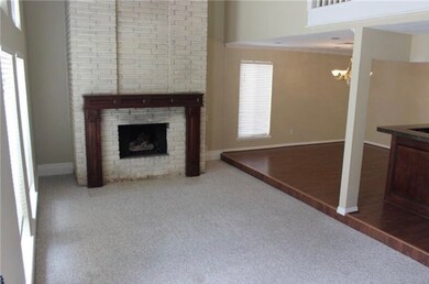 View of living room , High Ceiling , lots of natural lighting .