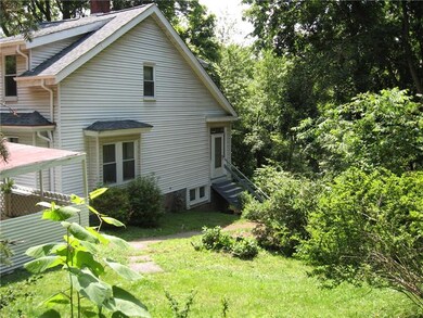Side entry and a great spot for a home garden.