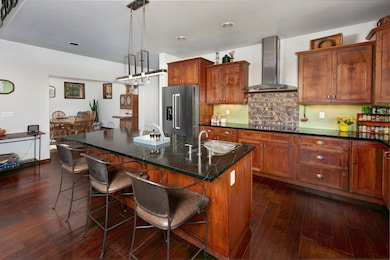 Kitchen with wall chimney exhaust hood, high end r