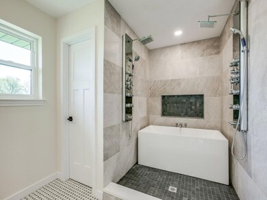 Gorgeous custom master bathroom with double shower tower