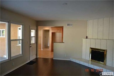 Bright family room with fireplace and pool view