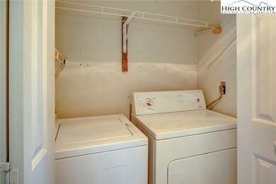 Laundry area across the hallway from the half bath