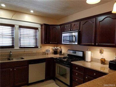 Kitchen. Lots of granite counters, recessed & unde