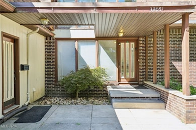 Doorway to property with brick siding