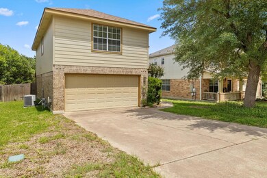View of front of home with brick siding, concrete