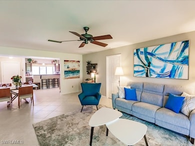 Tiled living room with ceiling fan