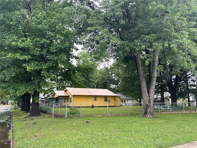 Tree lined street in Okmulgee Oklahoma. Move in re