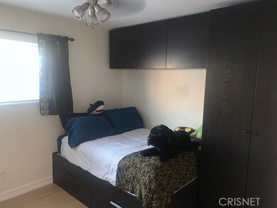 secondary bedroom with built in cabinets