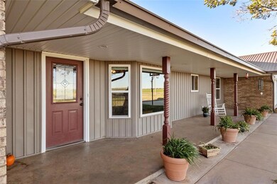 Property entrance with covered porch