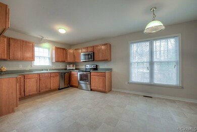 The spacious kitchen features new Stainless Steel