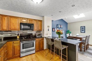 The updated kitchen offers custom cabinetry, quart