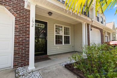 View of exterior entry with a garage and a porch