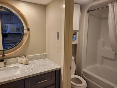 Full bathroom featuring vanity and toilet